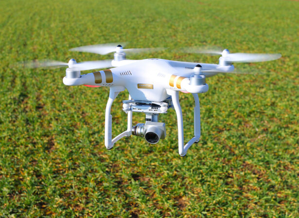 DJI Phantom drone scanning a crop field